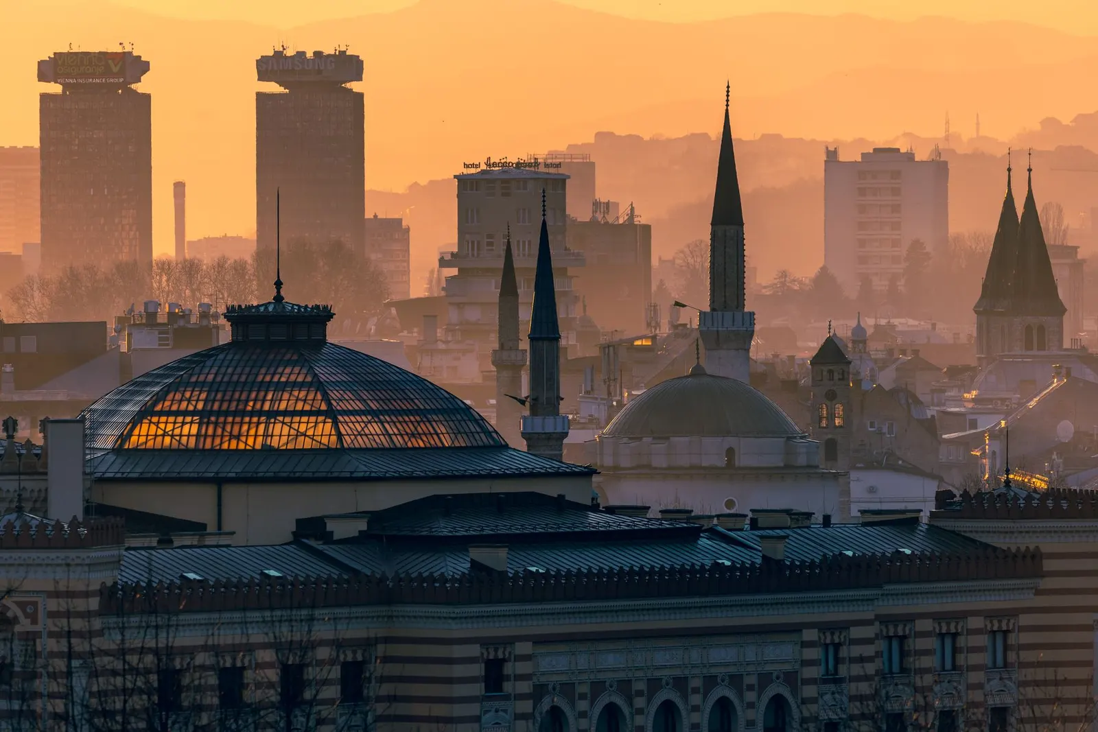 Sarajevo at sunset, city skyline with minarets